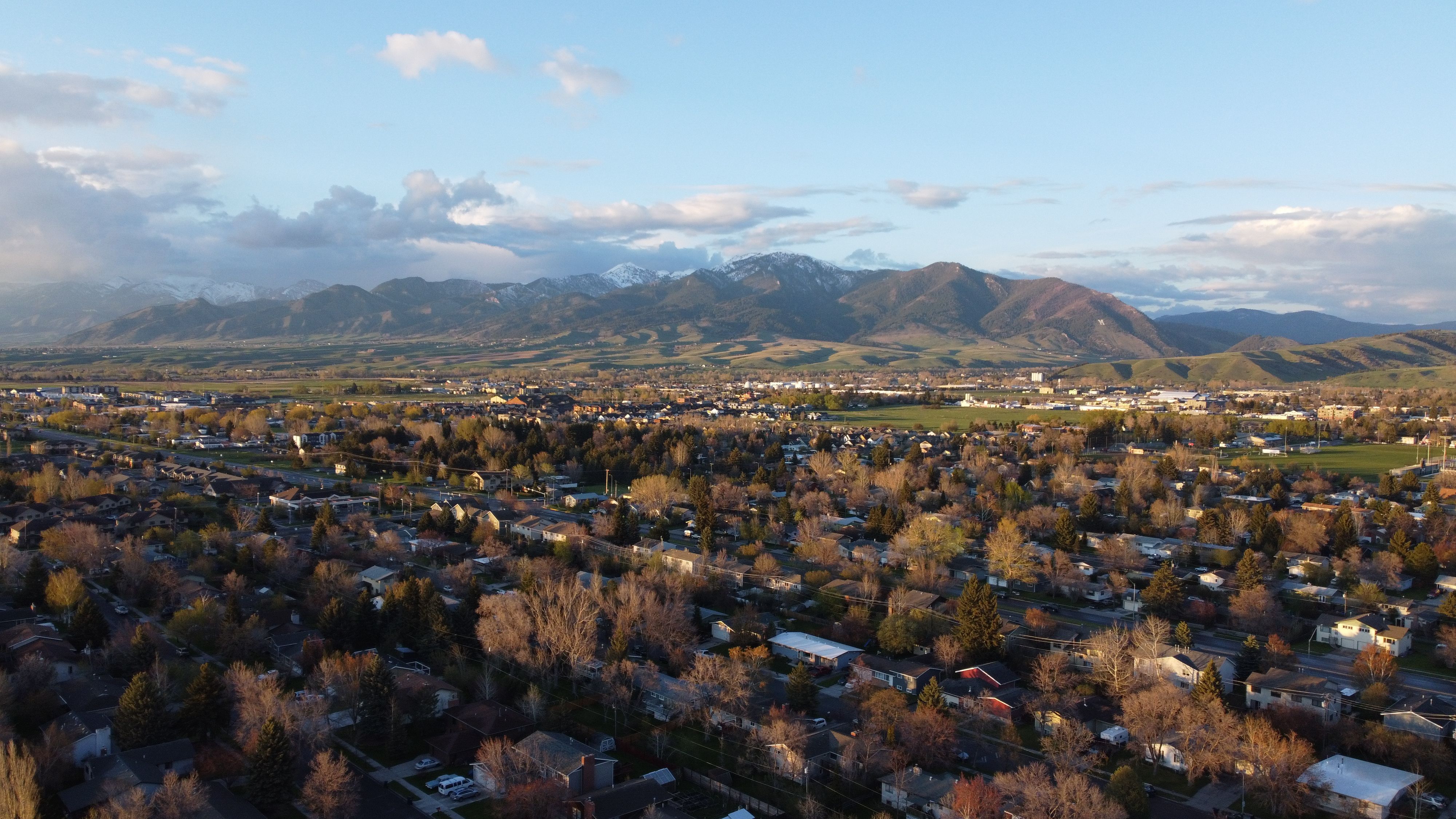 Birds-eye view of Bozeman, Montana, showing the popular neighborhoods with the famous Bridger Mountain Range in the background. 
